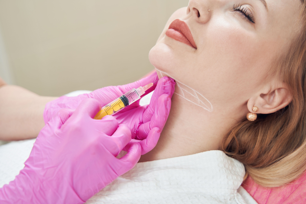 A woman getting her thyroid checked by an anesthetist.